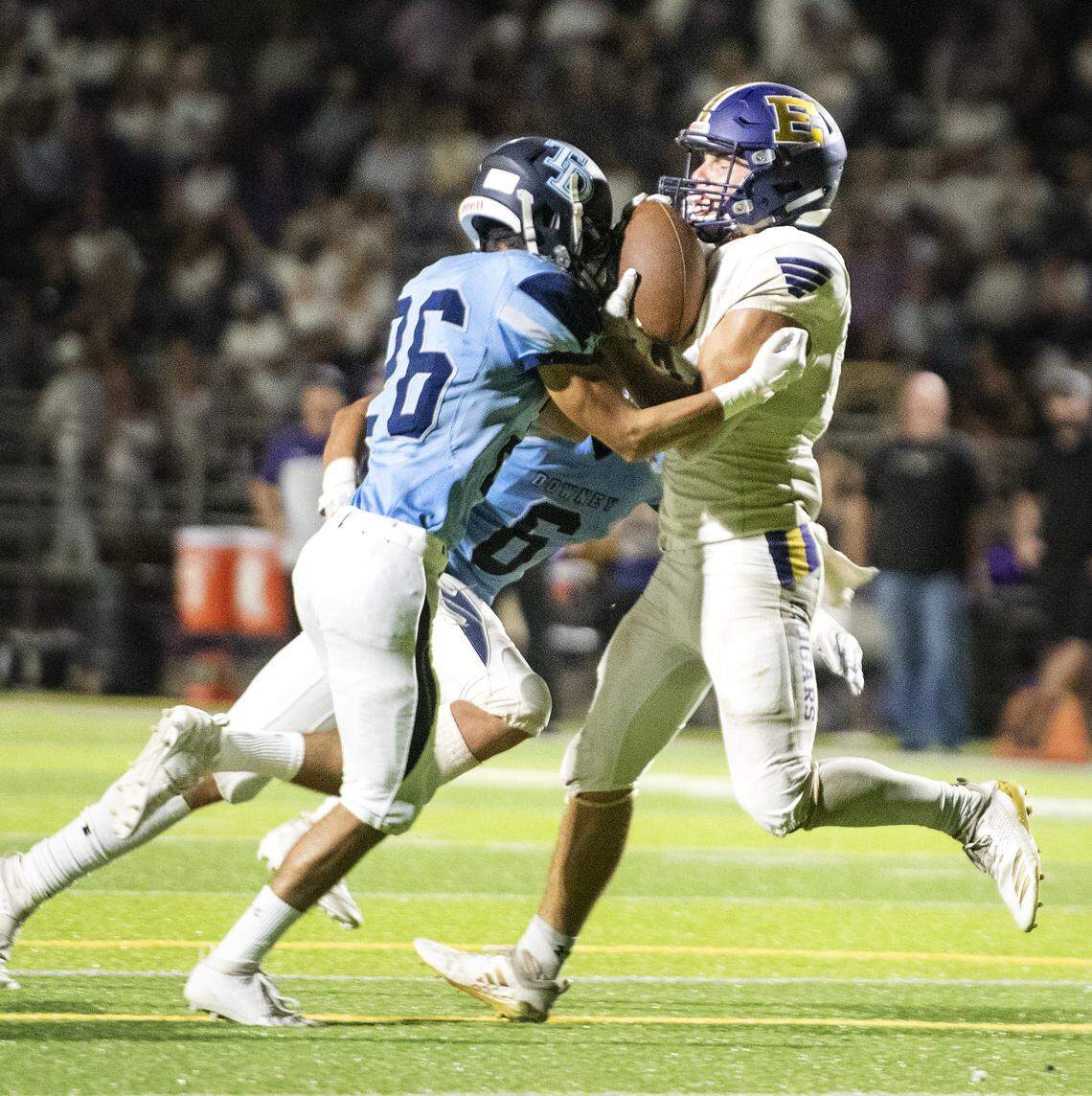 Escalon’s Kaden Christensen holds onto the ball for a reception as Downey’s Angel Zamora during the non-league game at Downey High School in Modesto, Calif., Friday, Sept. 13, 2019.