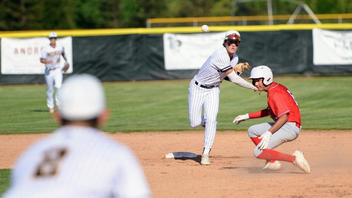 Hughson’s Beau Blake attempts to turn a double play during a Trans Valley League game against Ripon at Ripon High School in Ripon, Calif. on April 18, 2024.