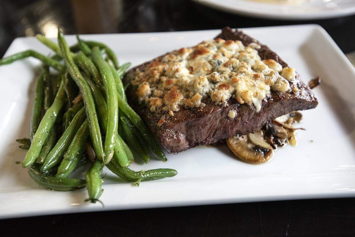 Flat Iron Steak with mushrooms and green beans at Table 26 restaurant in Turlock, Calif., on Thursday, Jan. 16, 2020. The restaurant closed at the start of this week for some minor renovations and plans to reopen in early February.