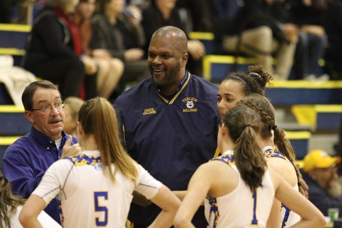 Turlock High School basketball coach John Williams, center, is pictured in 2018. Williams, 48, died Friday, Dec. 29, 2023, from injuries suffered in a car crash.