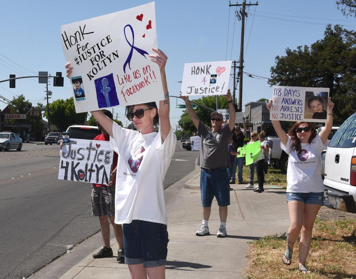 Amy Lawren protests with others Monday morning outside the Stanislaus County Coroner’s office on Oakdale road in Modesto, Calif. A report on the investigation on the death of Koltyn Sparks-Blackwood, has taken 100 plus days to release.