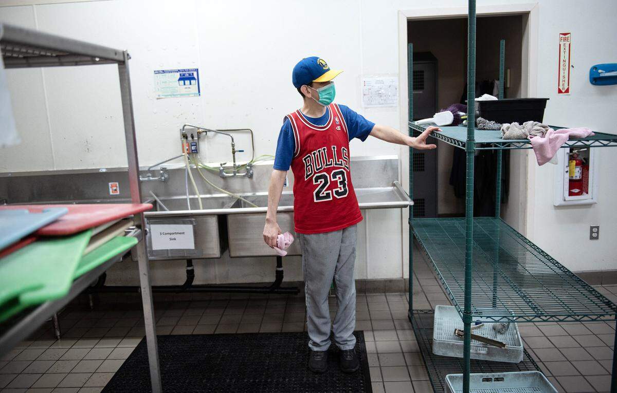 DJ Yarbrough works in the kitchen doing dishes and other cleaning tasks at Howard Prep in Ceres, Calif., Wednesday, Feb. 22, 2023.