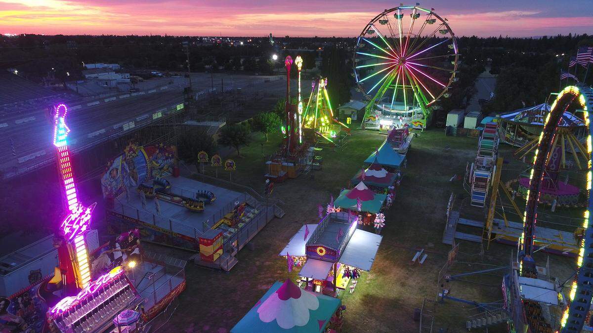 The midway at the Stanislaus County Fair in Turlock, Calif. is pictured Thursday evening July 12, 2018 at sunset by The Modesto Bee’s drone.