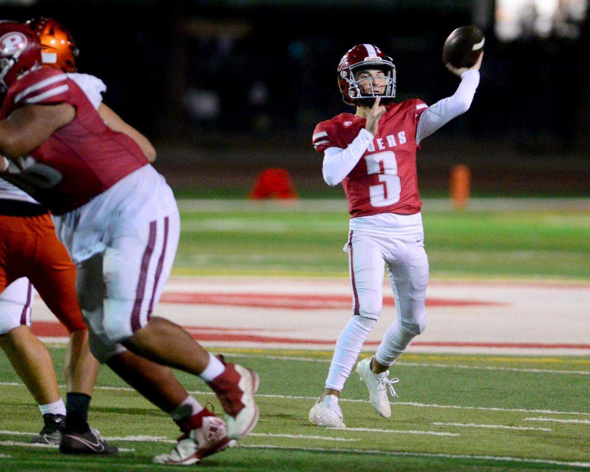 Patterson quarterback Max Medina (3) throws a deep pass during a game between Patterson and Merced at Patterson High School in Patterson California on September 29, 2023.