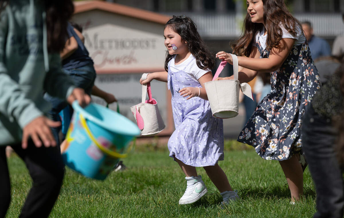 Sisters Kallie, 6, and Kiana Duyanen, 9, right, search for treats during the farmers market Easter egg hunt at the First United Methodist Church in Modesto, Calif., Saturday, April 8, 2023.