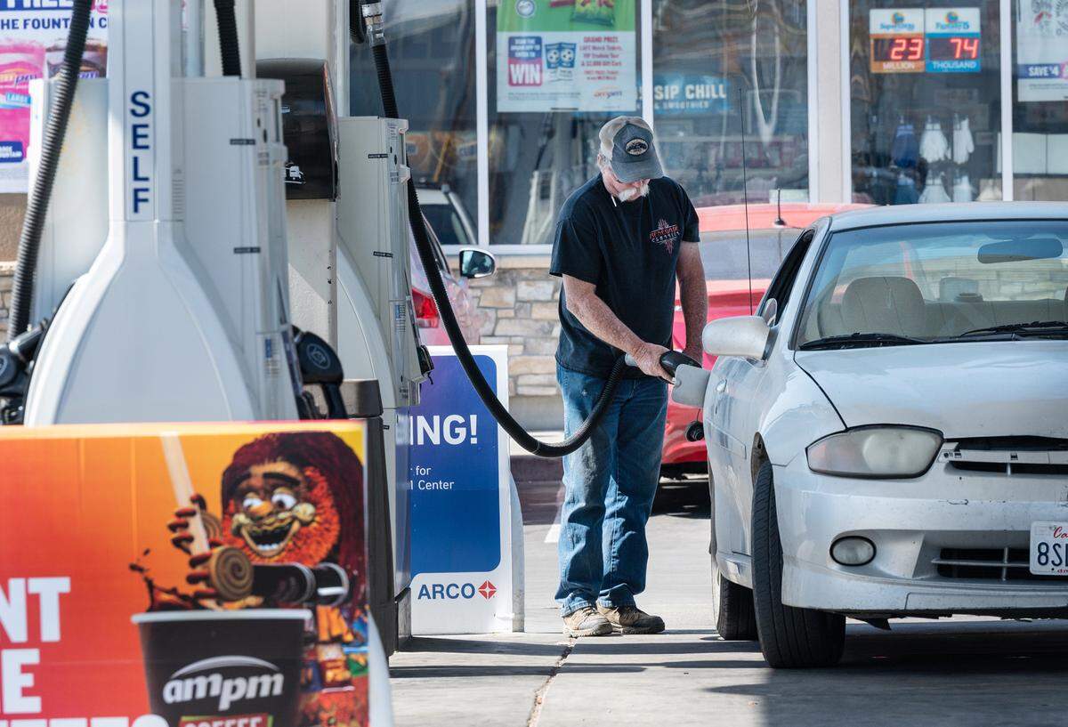 A customer fills up with gas at Arco on Crows Landing Road in Modesto, Calif., on Tuesday, March 8, 2022. According to GasBuddy the station had the lowest price for regular gasoline at $4.85 as of 12pm Tuesday.
