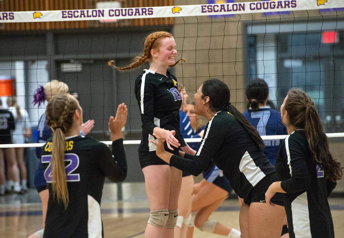 Escalon’s Rylie Lattig (10) and teammates celebrate a point during a non-league match with Downey in Escalon, Calif., on Tuesday, September 27, 2022.