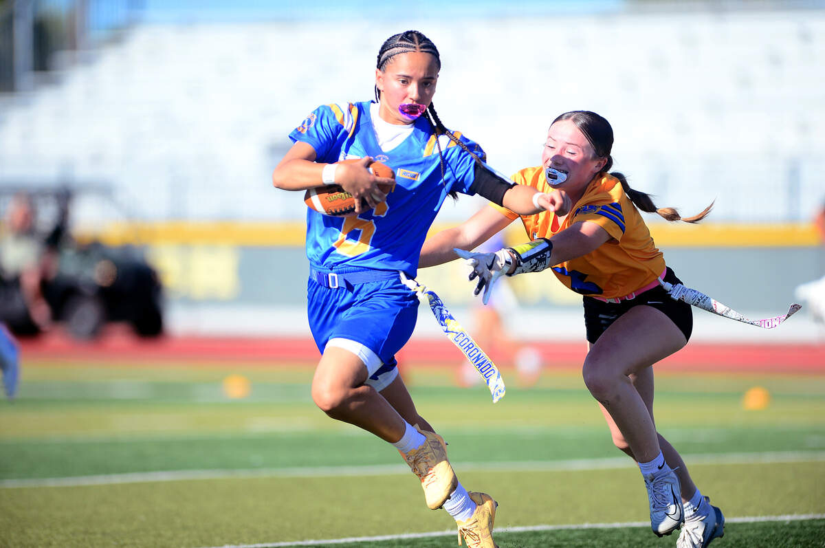 Ivy Butler (2) of Pitman chases down the opposing quarterback, Emma Coronado (6) of Kimball, during the Lions All-Star Game at Tracy High School in Tracy on Saturday, June 20, 2026.