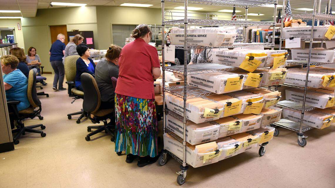 Election workers sort ballots Wednesday afternoon June 6, 2018 at the Stanislaus County Registrar of Voters office in downtown, Modesto, Calif.