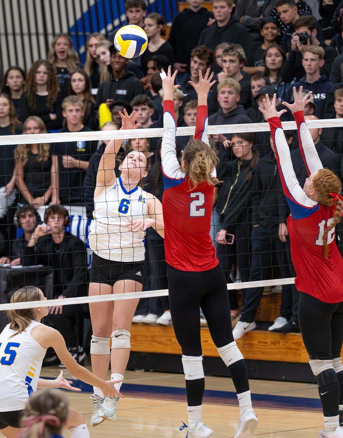 Ripon Christian’s Morgan Schenk floats the ball over Immanuel defenders during the CIF NorCal Regional Division IV Regional final match at Ripon Christian High School in Modesto, Tuesday, Nov. 18, 2025. 