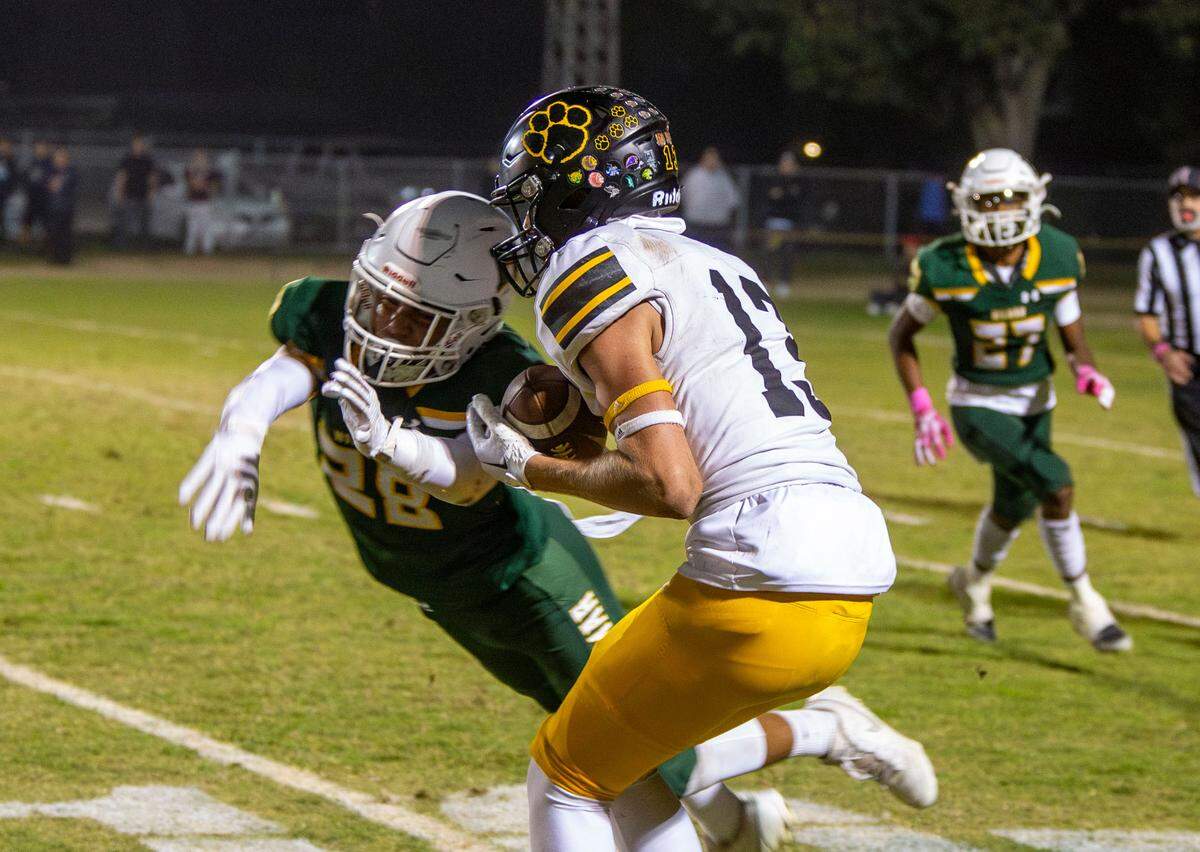 Bryce McDaniel, 13, of Hughson High School catches a pass and turns upfield for a touchdown during the Trans-Valley League game against Hilmar in Hilmar, Calif. on Friday Oct. 25, 2024.