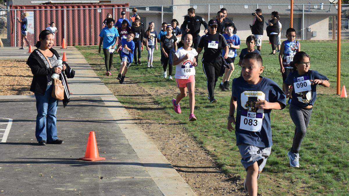 The first training run of the 10K With a Cop program was held Saturday, Sept. 22, 2018, at Shackelford Elementary School in Modesto. About 150 kids ran a mile with police officers, teachers, school administrators and others.