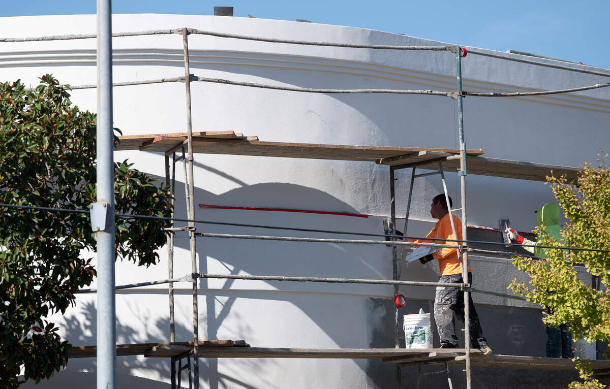 Plasterers put final touches on the former Crescent Supply building on 8th Street in Modesto, Calif., Thursday, Oct. 6, 2022.