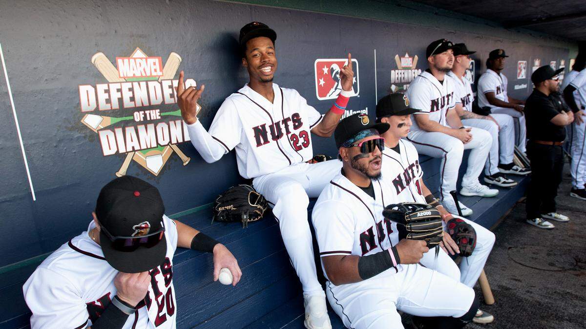 Modesto Nuts players, including Curtis Washington (23), await player introductions before the first home game of the season against the San Jose Giants at John Thurman Field in Modesto, Calif., Tuesday, April 11, 2023.