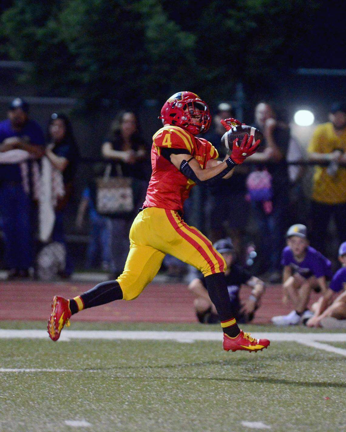 Oakdale receiver Joseph Delte (4) catches a deep pass for a touchdown during a game between Oakdale and Escalon at Oakdale High School in Oakdale, California, on September 15, 2023.