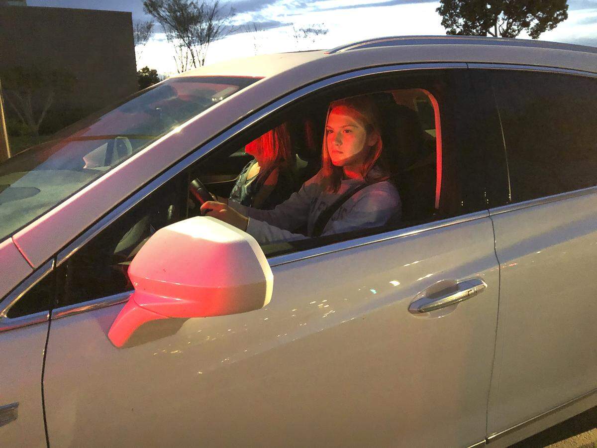 With her mom, Anne, riding shotgun, sophomore Fallon Wolfley arrives at Gregori High School in Modesto early Tuesday morning, March 9, 2020.