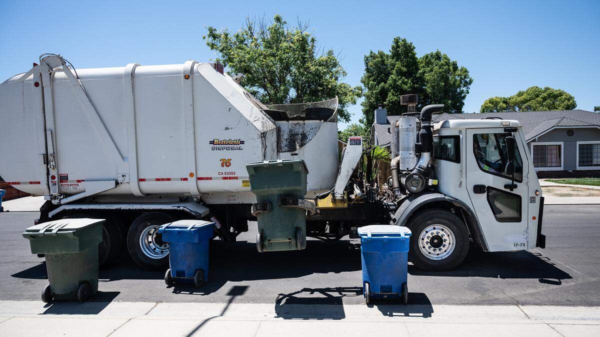 A Bertolotti disposal truck collects garbage in Ceres, Calif., on Tuesday, June 22, 2021.
