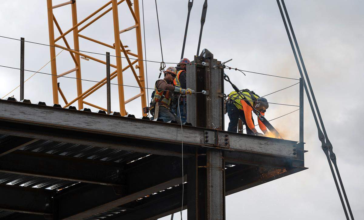 A crew works on the construction of the steel framing the new courthouse in downtown Modesto, Calif., Wednesday, Nov. 9, 2022.