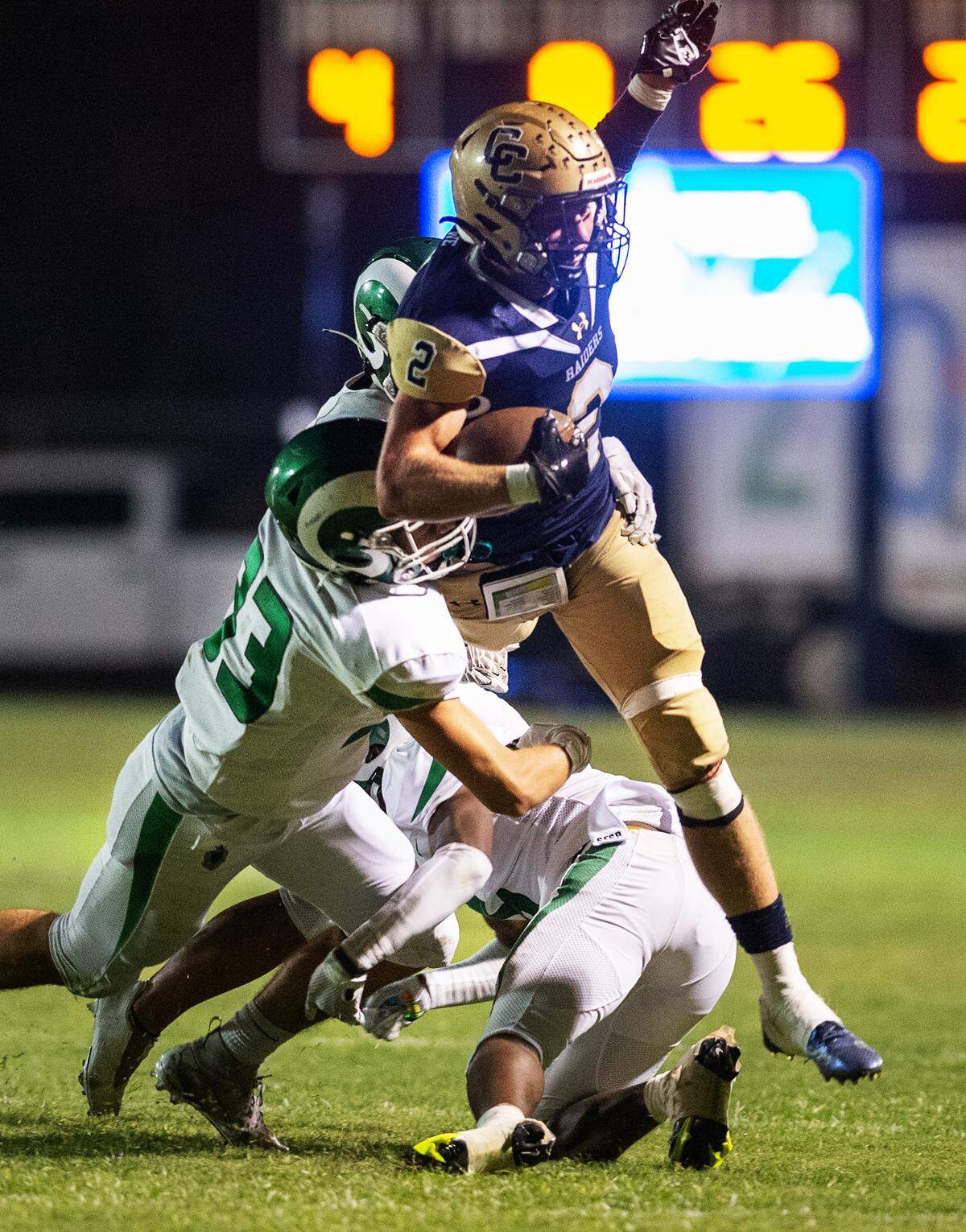 Central Catholic’s Tyler Jacklich tries to lunge for a first down but is stopped by St. Mary’s defenders during the non-league game at Central Catholic High School in Modesto, Calif., on Friday, September 2, 2022.