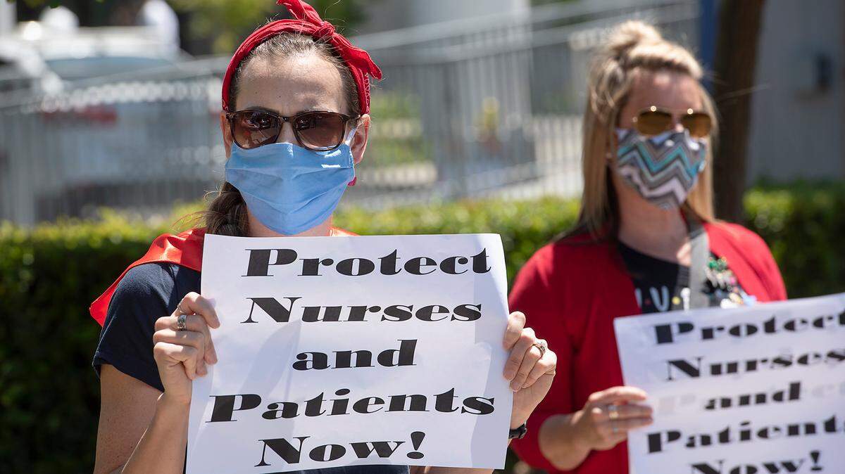 ICU nurse Rosemary Amaral, left, and fellow nurses at Emanuel Medical Center join 139 nationwide ÔMay DayÕ actions demanding COVID-19 protections for nurses and other health care workers in Turlock, Calif., on Thursday, May 1, 2020.