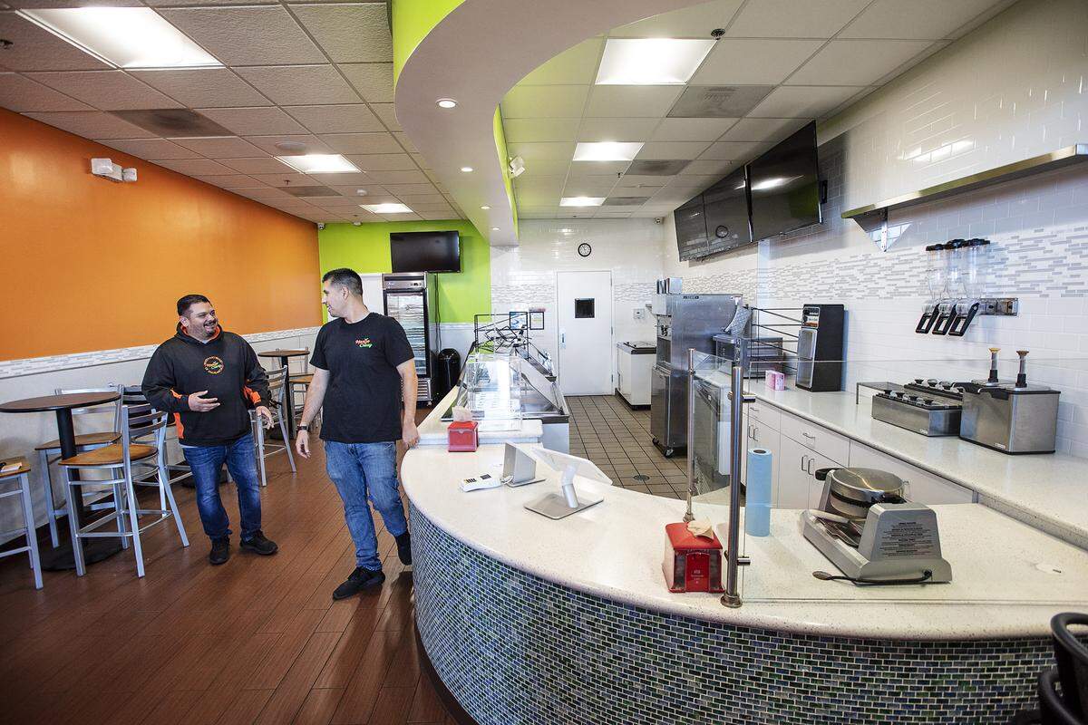 Mango Crazy owners Larry Rivera, left, and Andy Lopez, right, are expanding into the former Rita’s Italian Ice store in Ceres, Calif., on Wednesday, March. 11, 2020.