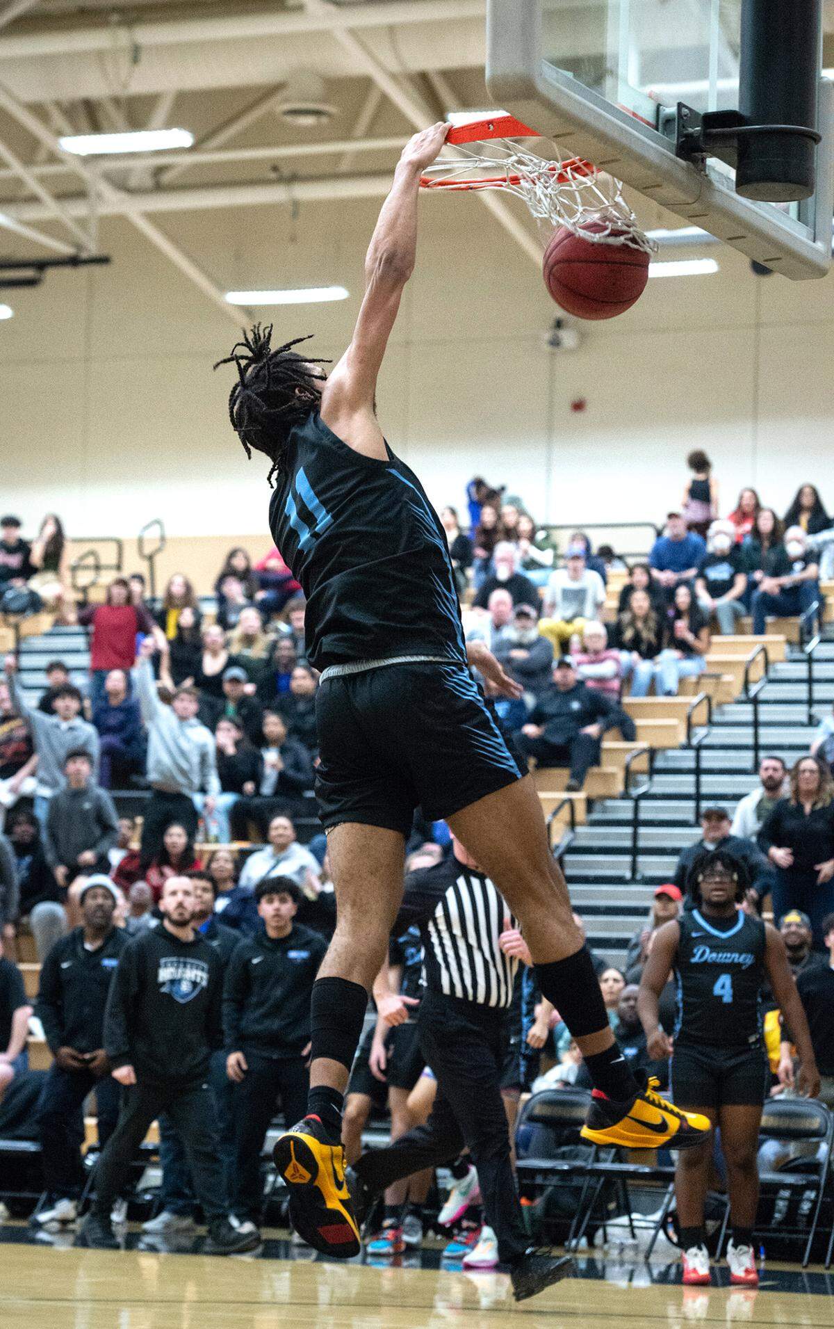 Downey’s Lloyd French scores on a dunk during the Central California Athletic League game with Enochs at Enochs High School in Modesto, Calif., Friday, Jan. 27, 2023.