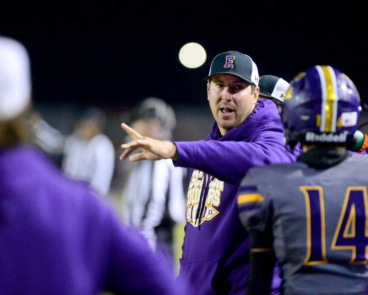 Escalon head coach Andrew Beam talks to his players during a 2023 CIF San Joaquin Section Division IV football game between Escalon and West Park at Escalon High School in Escalon, California, on Nov. 17, 2023. Escalon won the game 48-28.