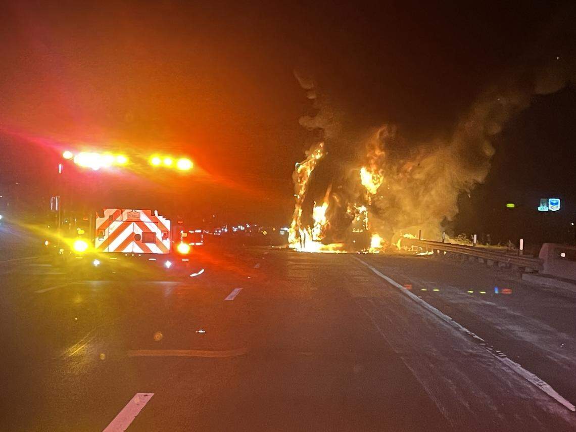 Flames engulf a semi-trailer on northbound Highway 99 near the Fourth Street exit in Ceres late Thursday night. The trailer caught fire after partially separating from the tractor and dragging along the highway, authorities said.