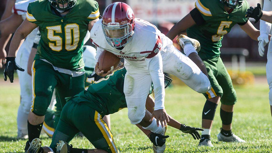Patterson’s Jordan Imada runs the ball during the Western Athletic Conference game at Johansen High School in Modesto, Calif., on Friday, April 9, 2021.
