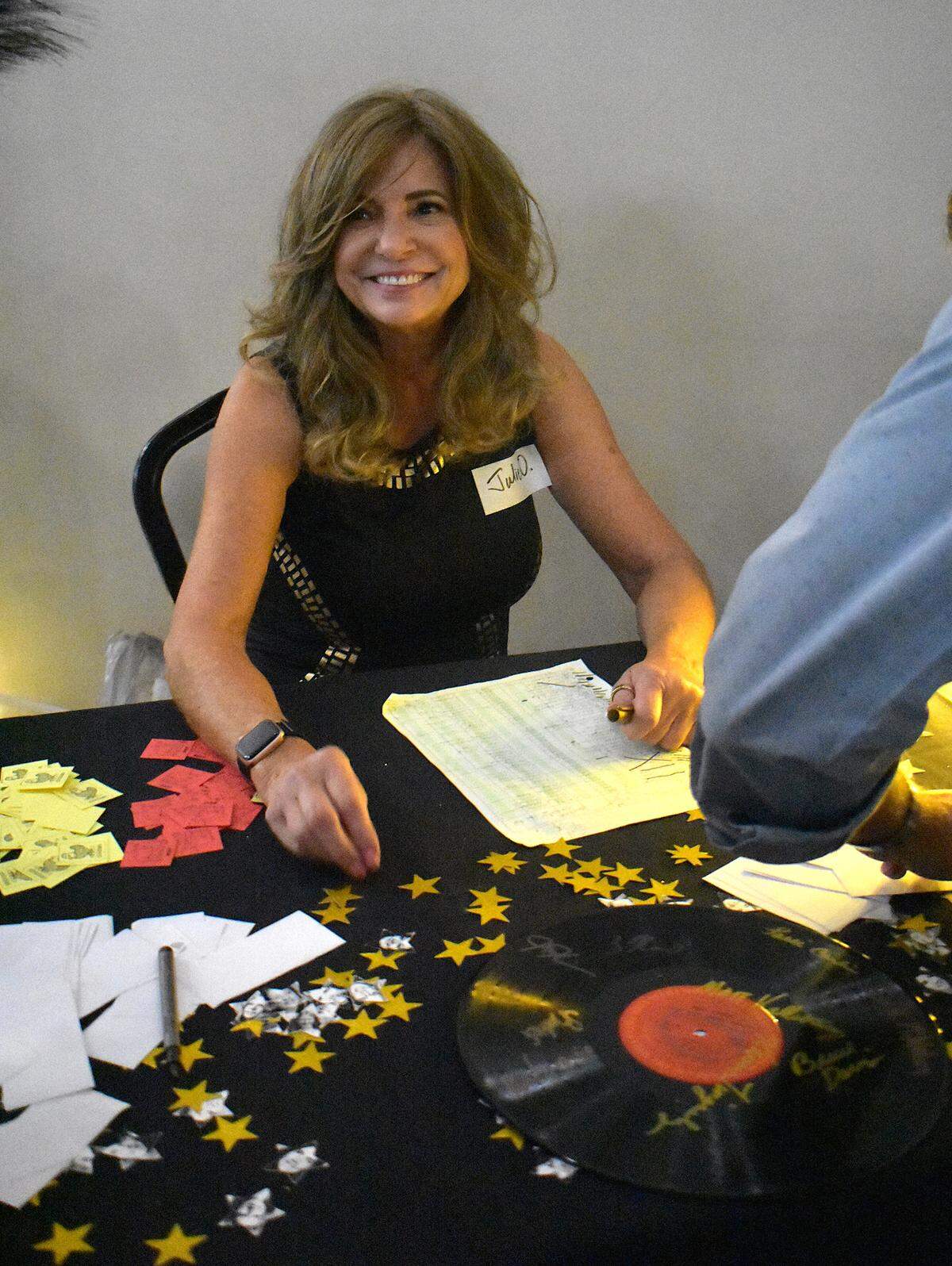 Julie Oblauskii welcomes alumni to the Beyer High School Class of 1975’s 50-year reunion at Del Rio Country Club north of Modesto on Saturday, Sept. 13, 2025. She took over the responsibility of organizing the Class of 1975’s reunions after her best friend and classmate Linda Adams Miranda died in 2020. “It’s just because I still have these friends. That’s why I continue to do this, and I do this lovingly for Linda,” Oblauskii said. “Each five years, you become friendlier with everybody you went to school with. There’s no more lines, there’s no athlete versus the rah rahs versus the popular group. We’re just all Beyer High School, and that’s what gels really nice with each other.”
