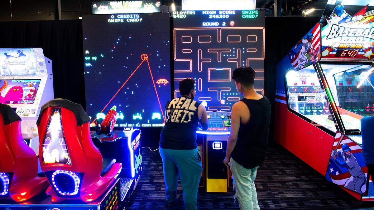Large screen vintage video games can be played at Dave & Buster’s entertainment center and restaurant at Vintage Faire Mall in Modesto, Calif., on Thursday, June 2, 2022.