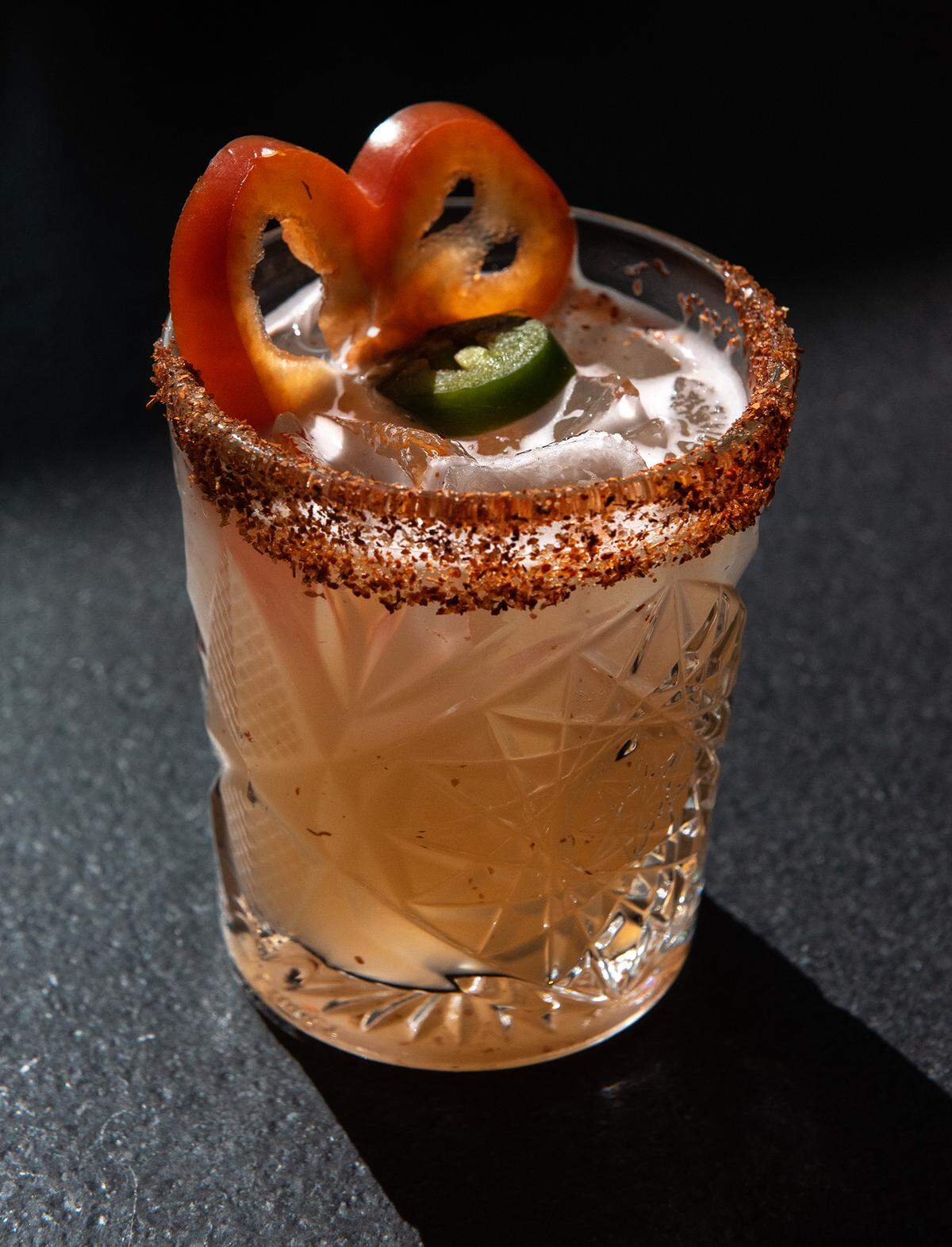 El Bandido Malo cocktail (fresh red bell pepper and serrano chile muddled with Sombra Mezcal, lime juice and agave) at Memo’s Cocina & Tequila Bar in Modesto, Calif., on Thursday, Feb. 24, 2022.