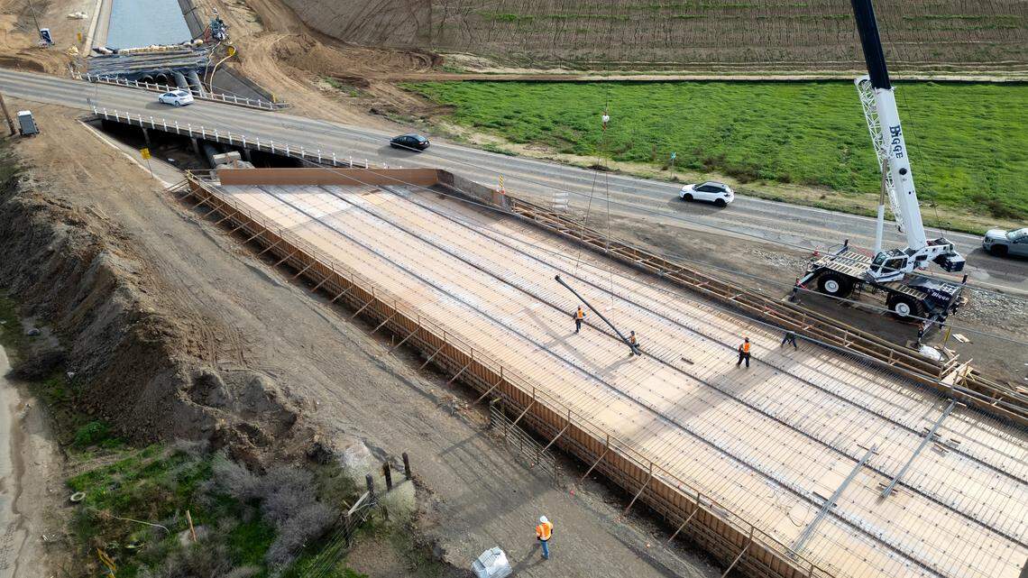 A crew works on the realignment of Claribel Road part of the North County Corridor expressway project in Modesto, Monday, Dec. 22, 2025.