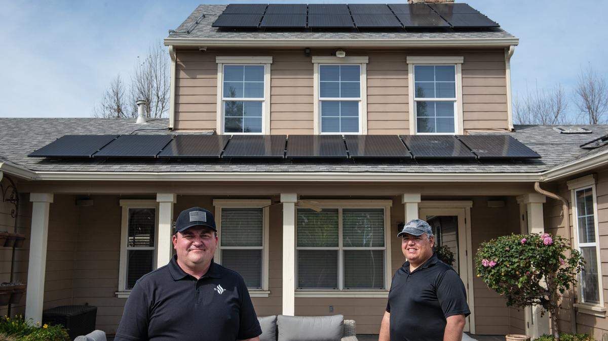 Solar Energy Partners founder Clint Williams, left, and regional manager Anthony Pimentel, right, in Ripon, Calif., on Wednesday, March 24, 2021.