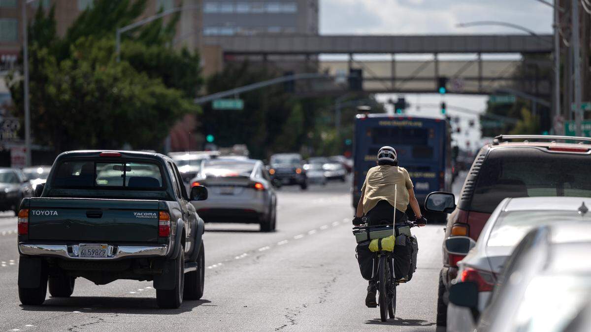 A cyclist rides down Ninth Street in Modesto, Tuesday, Sept. 9, 2025. The City is planning to make improvements to the well-traveled route including a protected bike lane from Needham and L Streets.