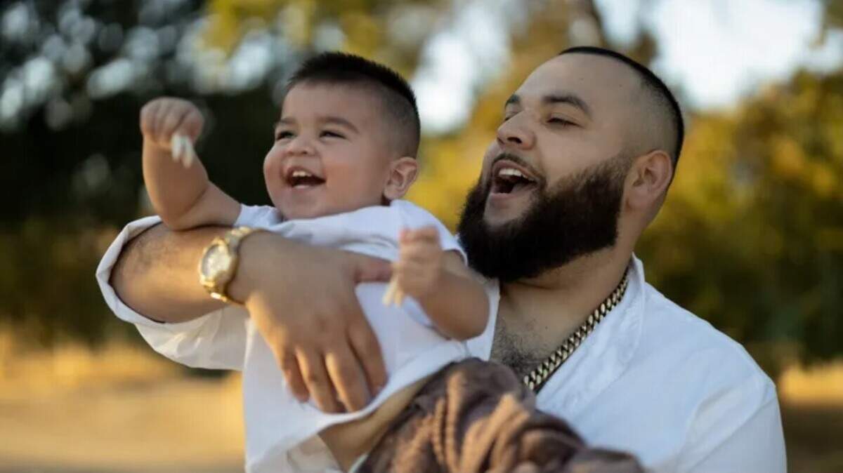 Crash victim Timoteo Alvarez Torres holding his child.