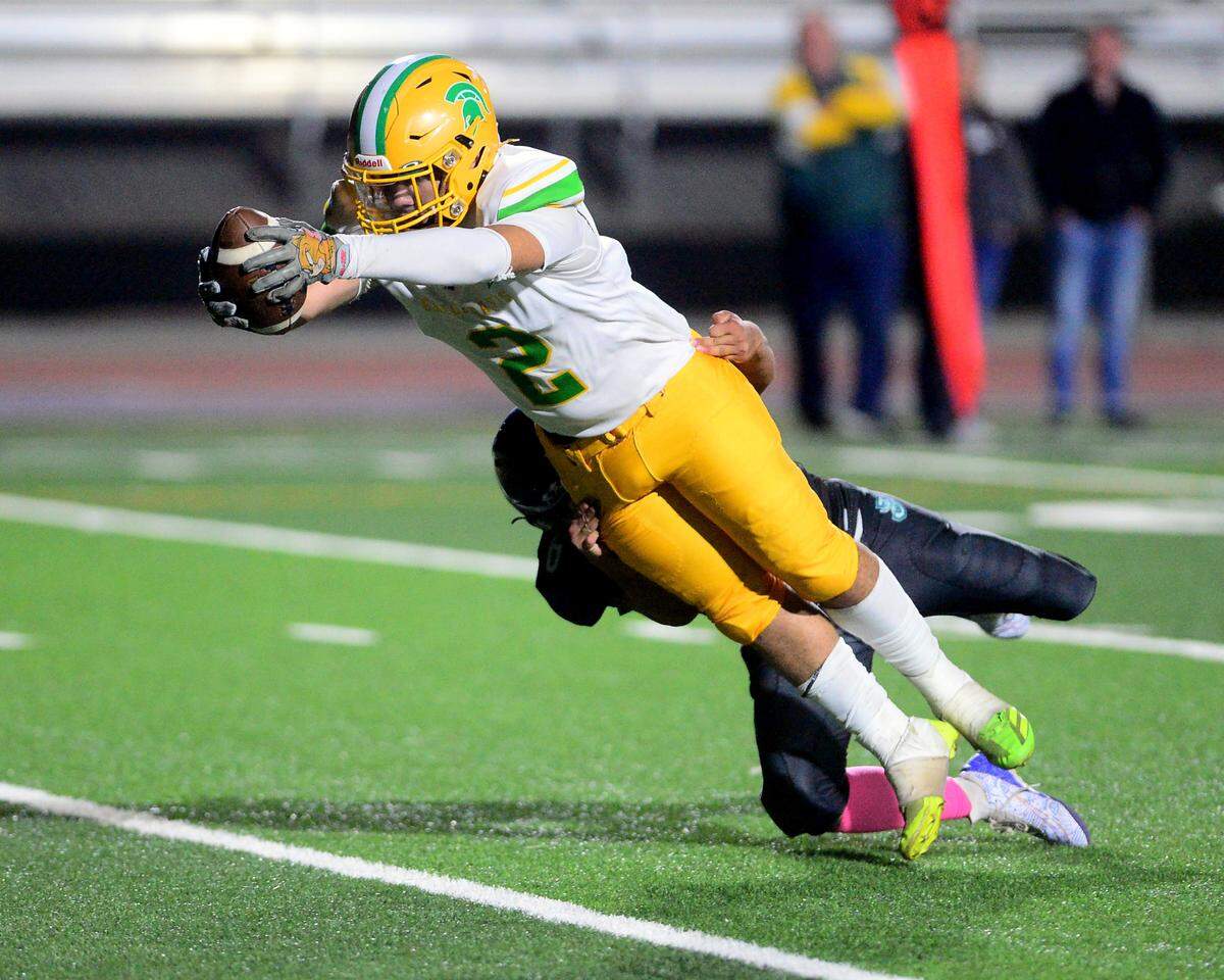 Davis receiver Miguel Olvera Deanda (2) dives into the endzone to score a touchdown during a game between Johansen and Davis at Johansen High School in Modesto California on November 1, 2024.