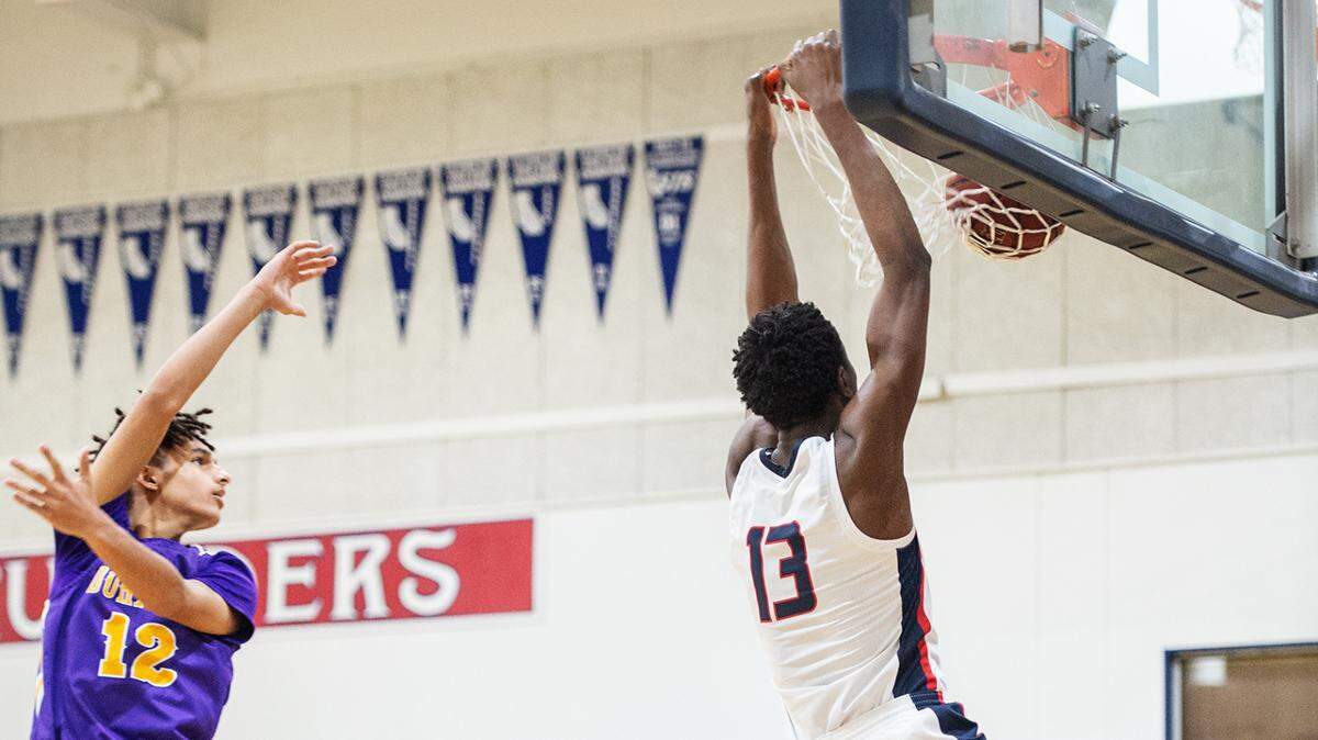 Modesto Christian’s Prince Oseya dunks for two during the Holiday Hoops Classic championship game with Durango NV in Salida, Calif., on Thursday, Dec. 30, 2021.