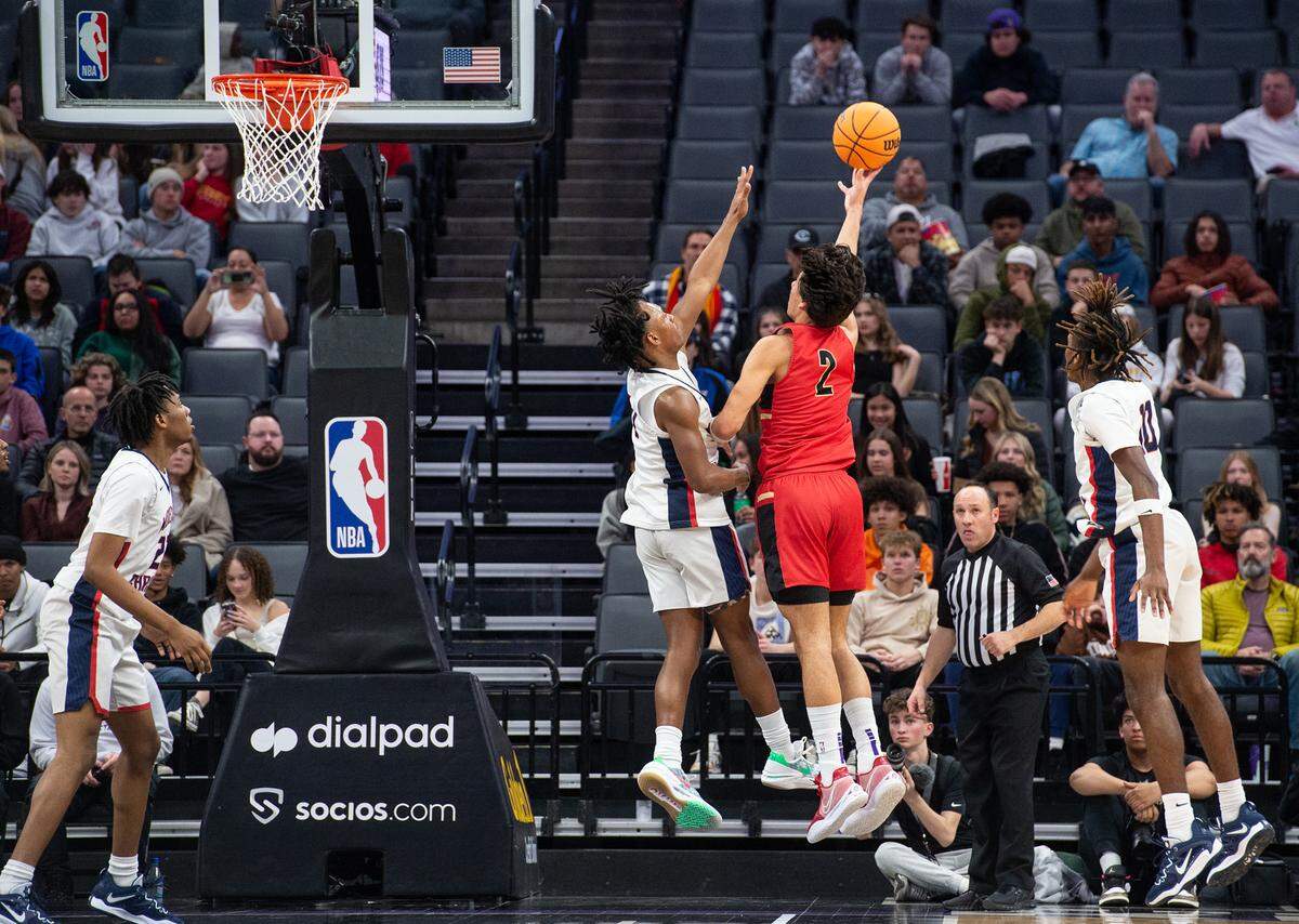 Modesto Christian’s Jeremiah Bernard defends on Jesuit’s Andrej Stojakovic during the Sac-Joaquin Section Division I championship game at Golden 1 Center in Sacramento, Calif., Saturday, Feb. 25, 2023.