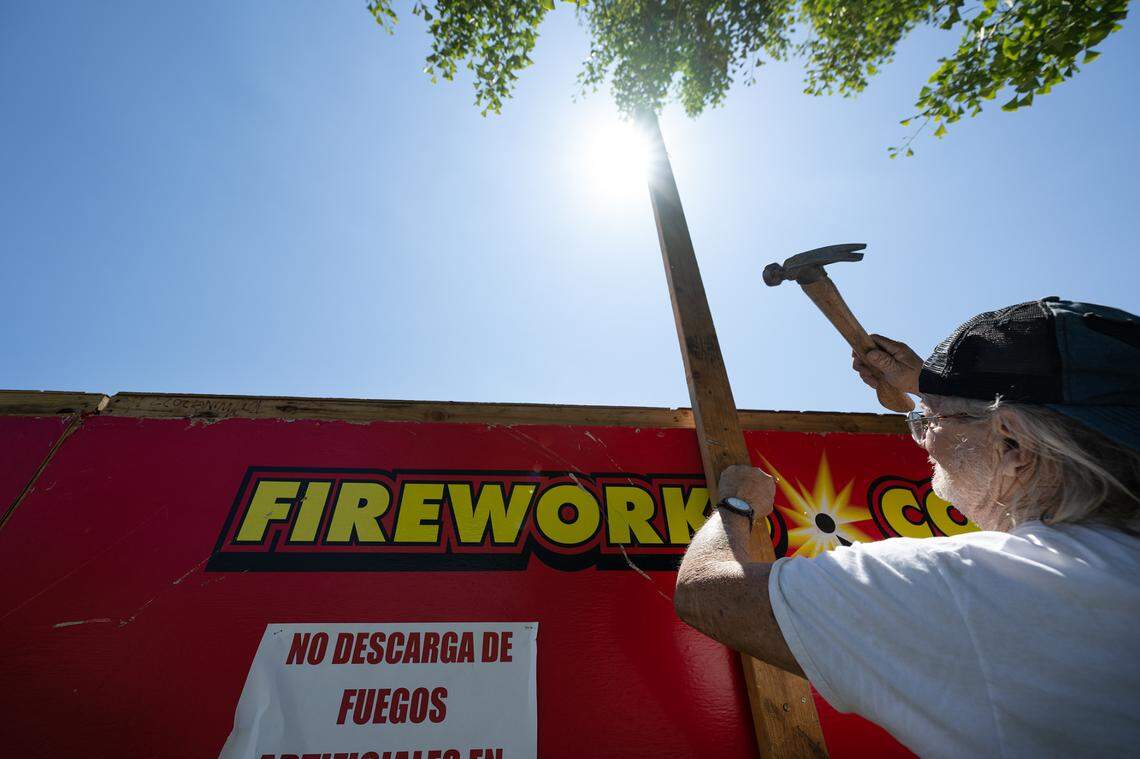 Will Plumley finishes assembling a fireworks stand at 1800 Oakdale Road in Modesto, Calif., Wednesday, June 21, 2023. Local nonprofit Knights of Columbus will sell fireworks out of the stand on Oakdale Road.