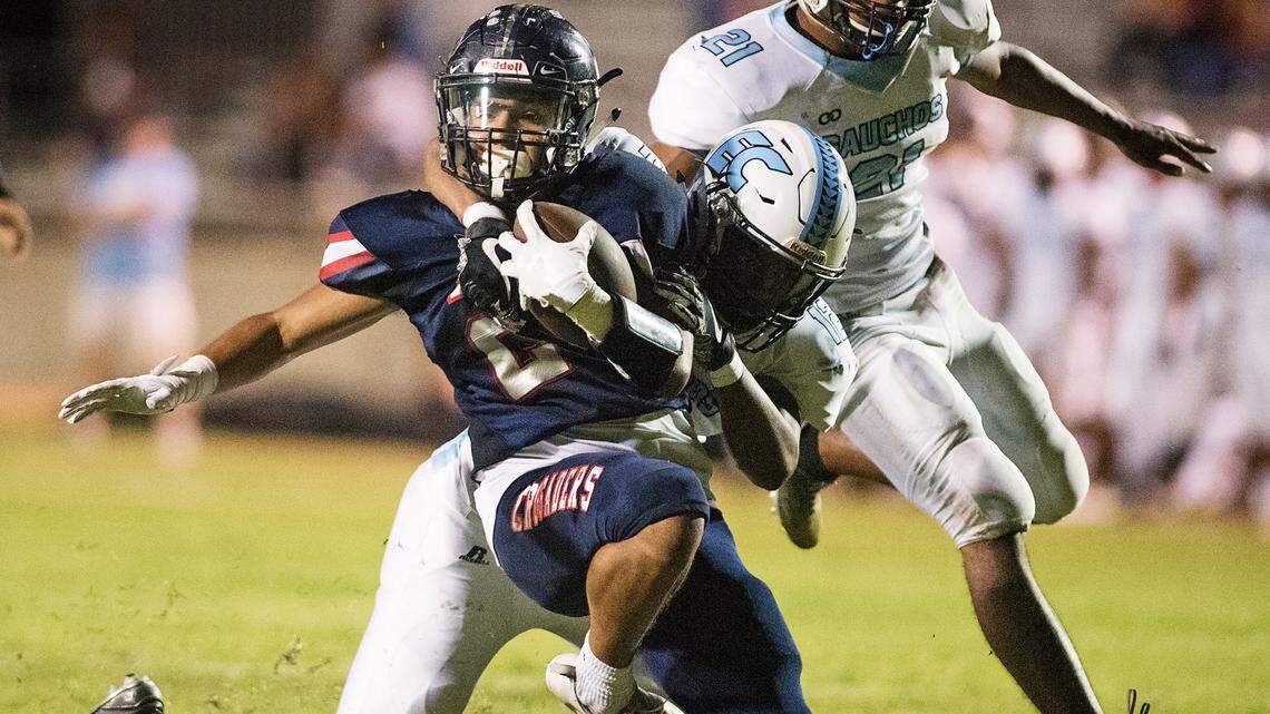 Modesto Christian’s Isaac Schinmann is tackled after a long gain by El Capitan’s Emanuel Evans during the non-league game in Salida, Calif., on Friday, September 7, 2018. Modesto Christian won the game 47-8.