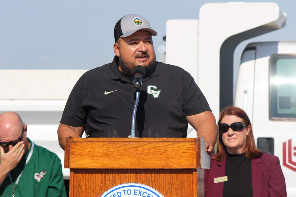Ceres Mayor Javier Lopez speaks on the podium in front of attendees during the stadium ceremony at Central Valley High School on June 9, 2025