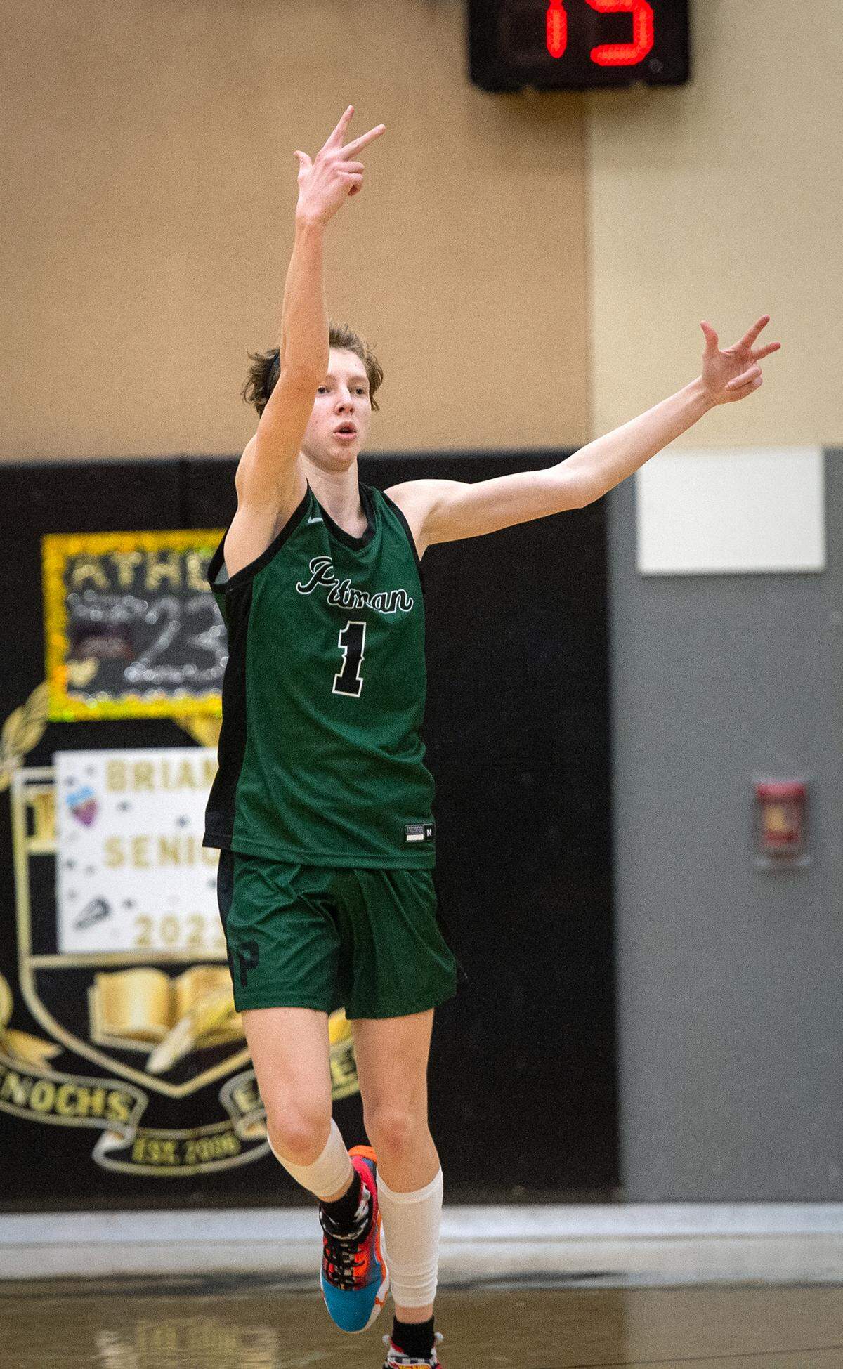Pitman’s Avery Sanchez signals to the crowd after scoring a three-point basket during the Central California Athletic League game with Enochs at Enochs High School in Modesto, Calif., Friday, Feb. 10, 2023. Pitman won the game 56-52.