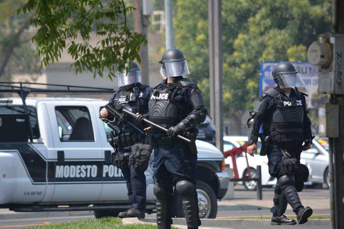 Modesto police disperse crowds from a “straight pride” rally where Proud Boys brawled with counter-protesters in August. Two people were arrested, including a man elected to the Sacramento County Republican Party Central Committee in March.