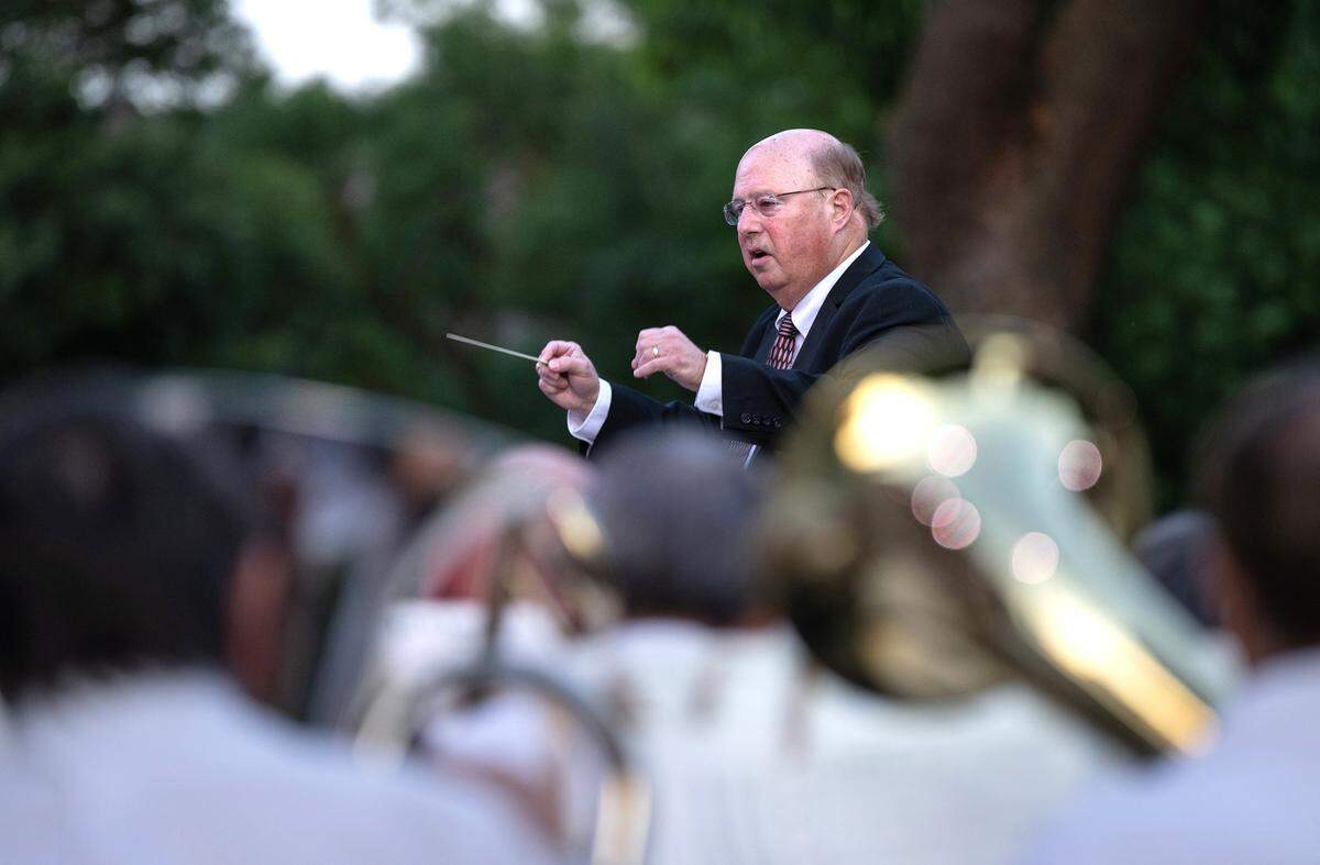 Conductor George Gardner leads MoBand during its first concert of the season at Mancini Bowl in Graceada Park in Modesto, Calif., Thursday, June 8, 2023.