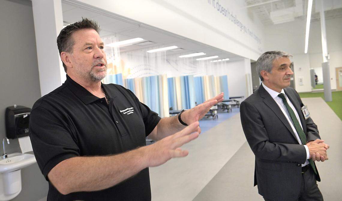 Dr. Eric Larson, chief of sports medicine for Kaiser’s Central Valley region, left,  talks about the new Sports Medicine Center in Salida, Friday, Aug. 8, 2025.