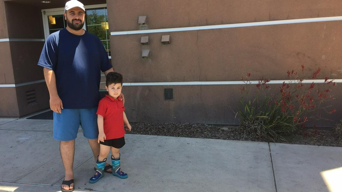Abdul, an evacuee from Afghanistan, and his 3-year-old son. The family has stayed at the Comfort Inn in Turlock, Calif. for five months while trying to find housing.