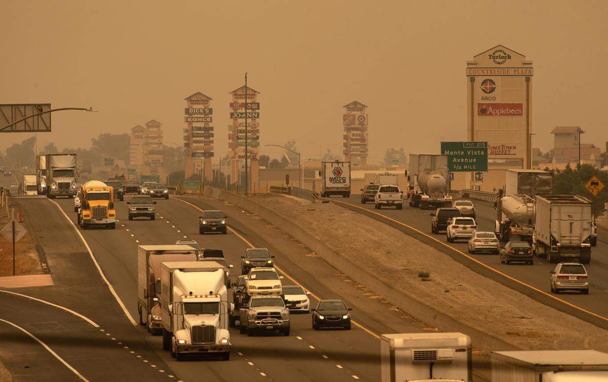 Smoke covers Turlock along State Highway 99 in Turlock, Calif., on Wednesday August 19, 2020.