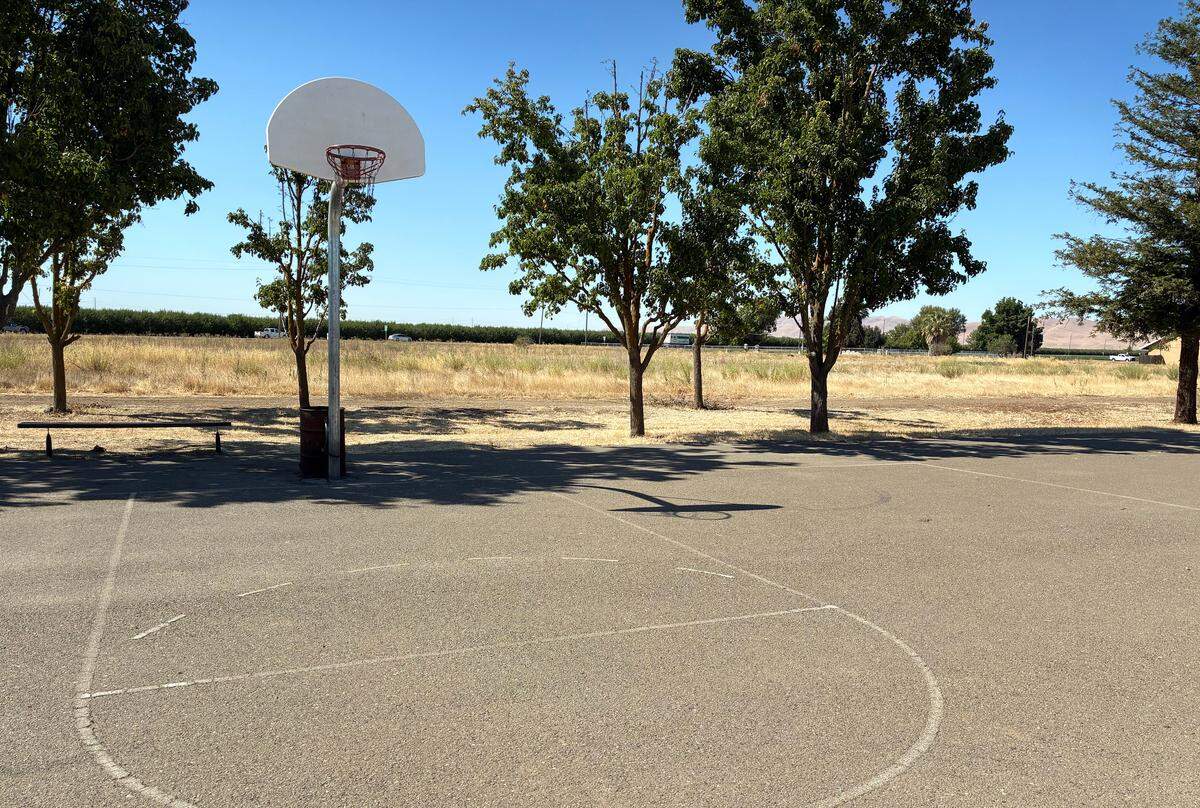 Basketball court at United Community Park overlooking a vacant field in Grayson, Thursday, July 24, 2025.