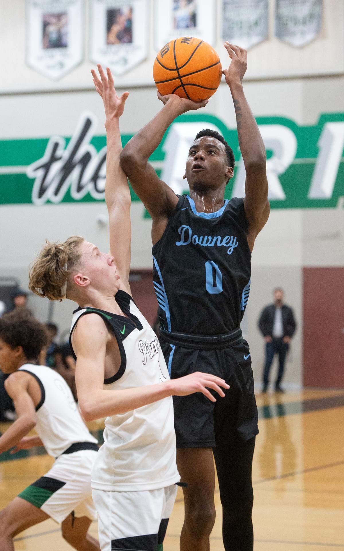 Downey’s Reuben Lewis scores on a jump shot over Pitman’s Avery Sanchez during the Central California Athletic League game in Turlock, Calif., Wednesday, Jan. 18, 2023. Downey won the game 52-44.